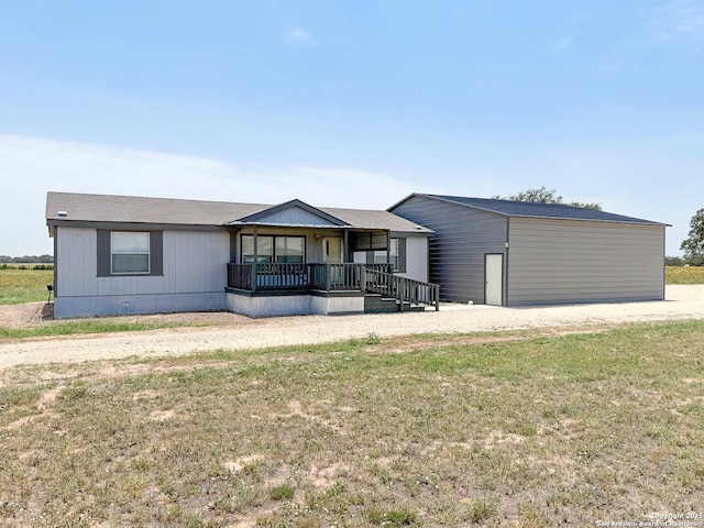 1185 County Road 7718, Devine, TX 78016 - manufactured / mobile home with a porch, crawl space, and a front yard
