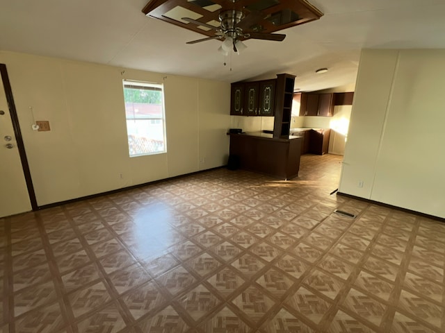 2230 Bear Springs Dr, San Antonio, TX 78245 - unfurnished living room featuring vaulted ceiling, a ceiling fan, and light floors