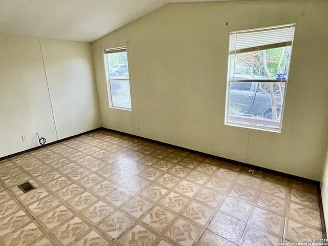 2230 Bear Springs Dr, San Antonio, TX 78245 - spare room with lofted ceiling and baseboards