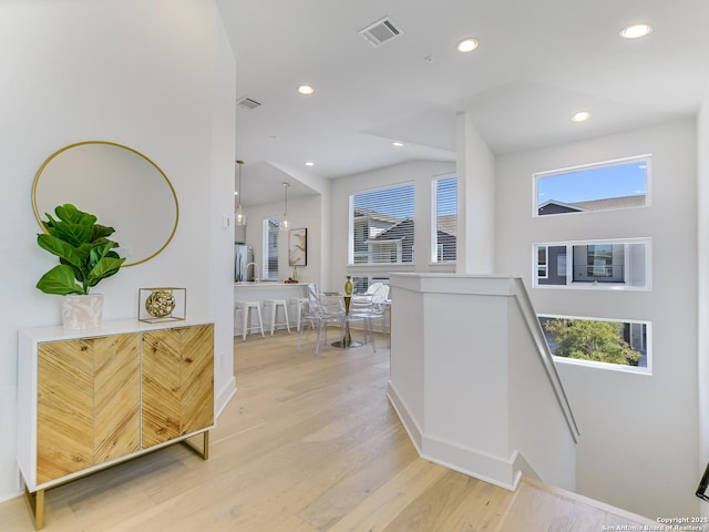 2050 Lohmans Spur Unit, Lakeway, TX 78734 - corridor featuring an upstairs landing, healthy amount of natural light, light wood finished floors, baseboards, and recessed lighting