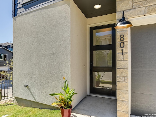 2050 Lohmans Spur Unit, Lakeway, TX 78734 - doorway to property featuring stucco siding