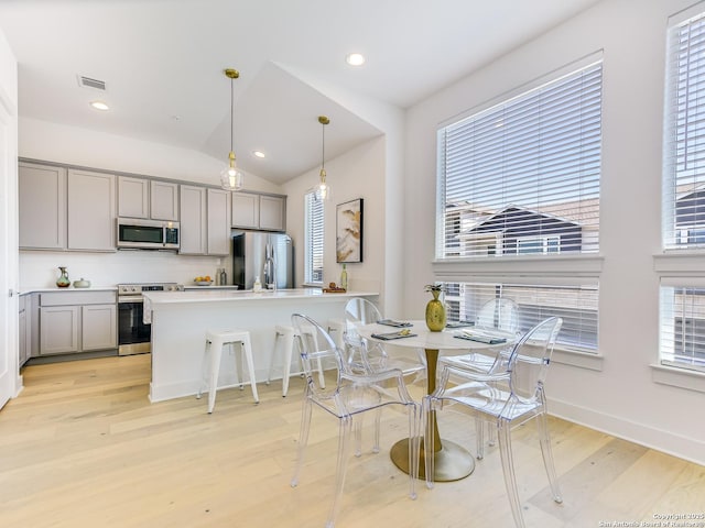 2050 Lohmans Spur Unit, Lakeway, TX 78734 - dining room featuring healthy amount of natural light, light wood-style floors, recessed lighting, baseboards, and lofted ceiling