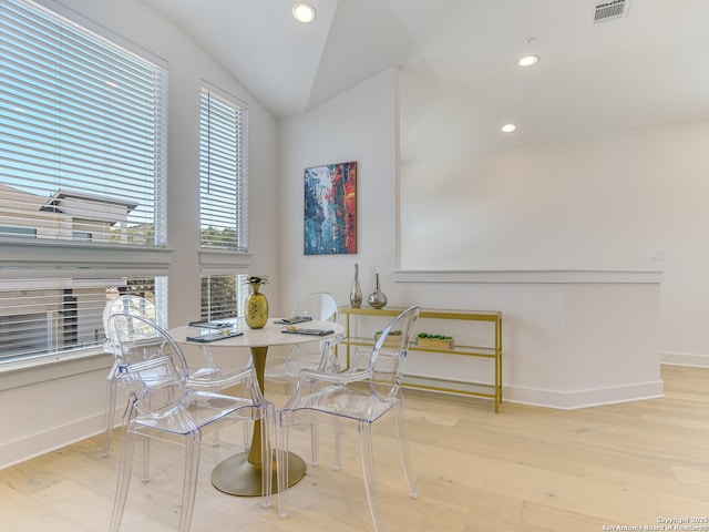 2050 Lohmans Spur Unit, Lakeway, TX 78734 - dining space featuring baseboards, wood finished floors, recessed lighting, and vaulted ceiling