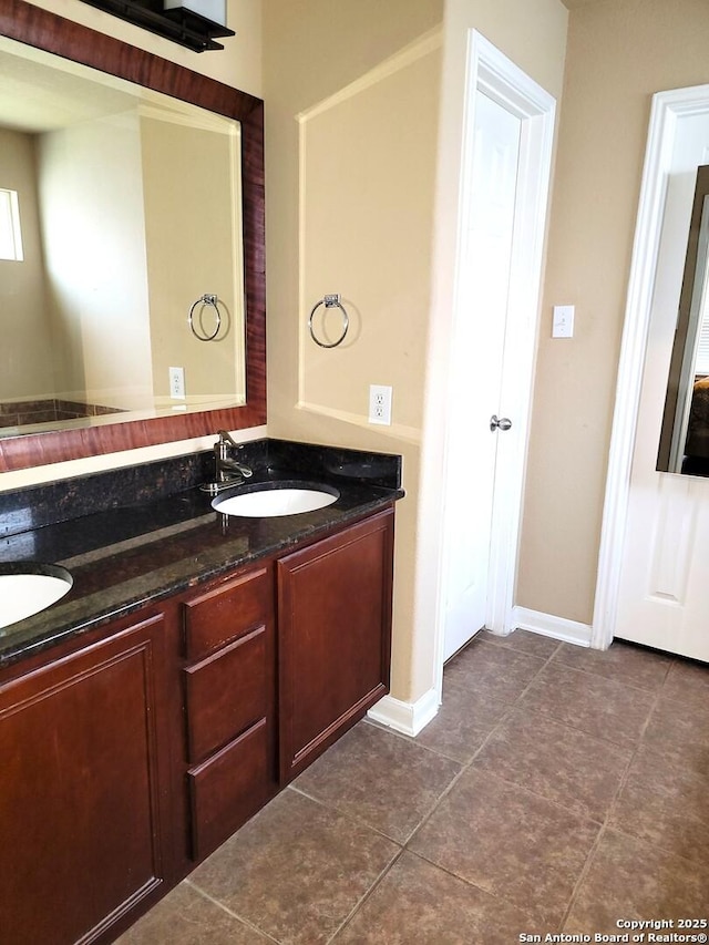 26106 Indian Clf, San Antonio, TX 78260 - bathroom featuring double vanity, tile patterned floors, and baseboards