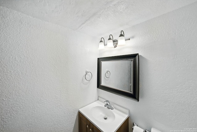 7122 Brecon, San Antonio, TX 78239 - half bathroom featuring vanity and a textured wall