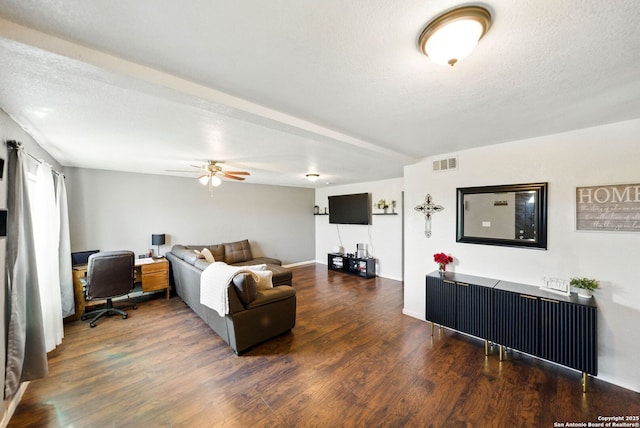 7122 Brecon, San Antonio, TX 78239 - living room featuring wood finished floors, ceiling fan, an office area, and a textured ceiling