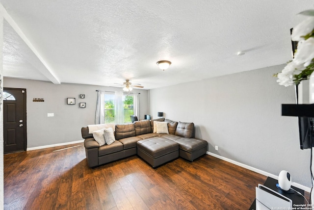 7122 Brecon, San Antonio, TX 78239 - living room with dark wood-style flooring, a textured ceiling, a ceiling fan, and baseboards