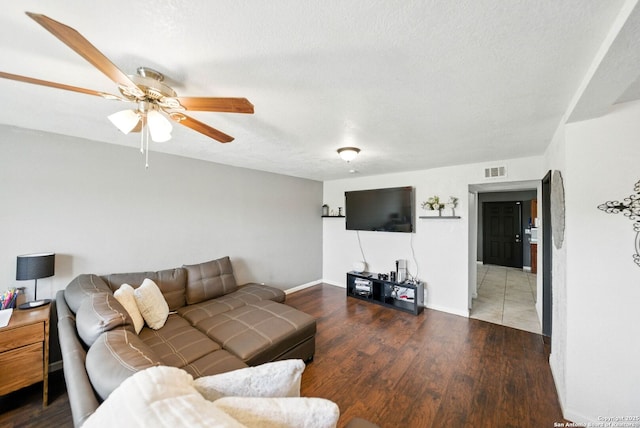 7122 Brecon, San Antonio, TX 78239 - living area with a ceiling fan, wood finished floors, a textured ceiling, and baseboards