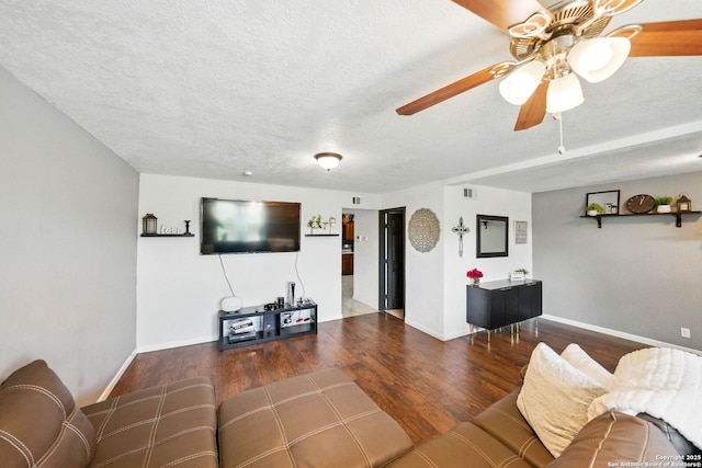 7122 Brecon, San Antonio, TX 78239 - living area featuring wood finished floors, baseboards, a textured ceiling, and a ceiling fan