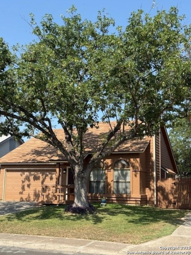 6210 Valley Clf, San Antonio, TX 78250 - view of front of house with a garage, driveway, and a shingled roof