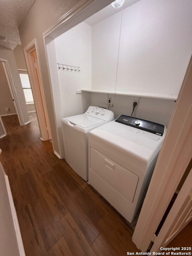 6210 Valley Clf, San Antonio, TX 78250 - washroom with independent washer and dryer, a textured ceiling, and dark wood-style flooring