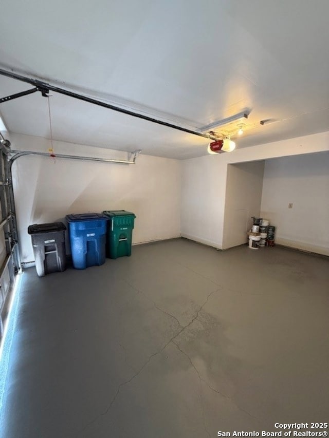 6210 Valley Clf, San Antonio, TX 78250 - garage featuring a garage door opener