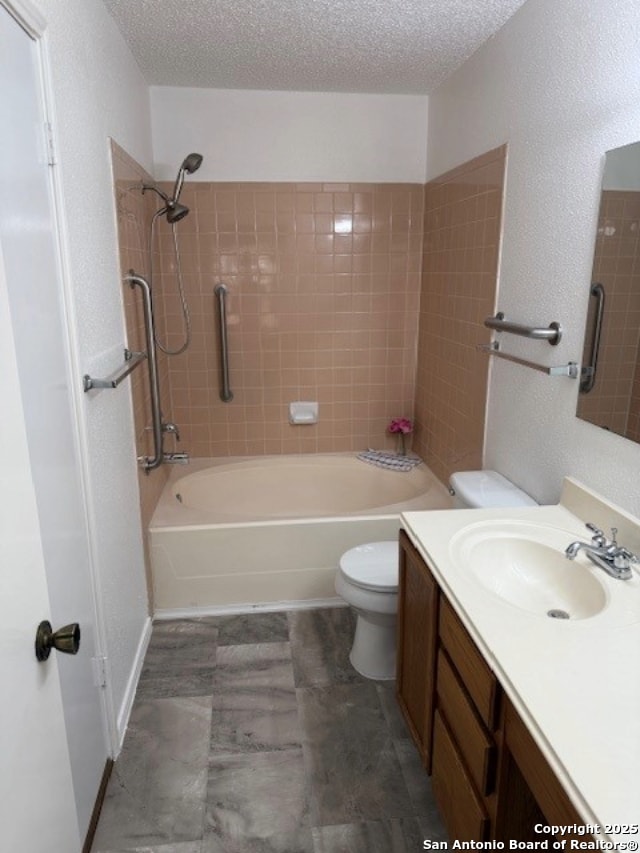 6210 Valley Clf, San Antonio, TX 78250 - full bath with vanity, bathing tub / shower combination, toilet, a textured ceiling, and a textured wall