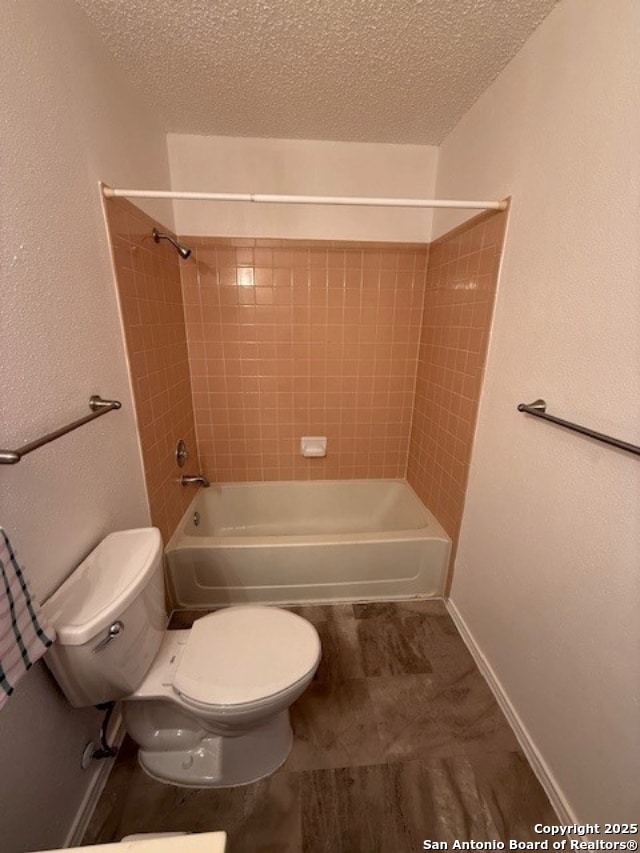 6210 Valley Clf, San Antonio, TX 78250 - full bathroom featuring a textured ceiling,  shower combination, and toilet