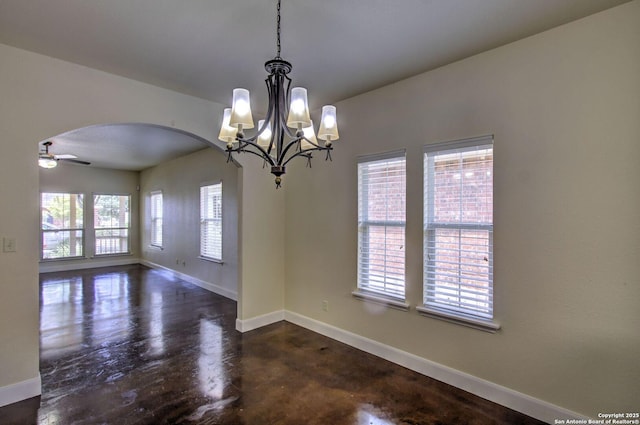 2222 Gruene Lk, New Braunfels, TX 78130 - spare room featuring arched walkways, baseboards, a chandelier, and ceiling fan
