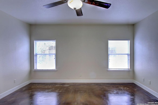 2222 Gruene Lk, New Braunfels, TX 78130 - unfurnished room with concrete floors, baseboards, and ceiling fan