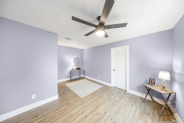 1437 Avant, San Antonio, TX 78210 - spare room featuring a ceiling fan, baseboards, and wood finished floors