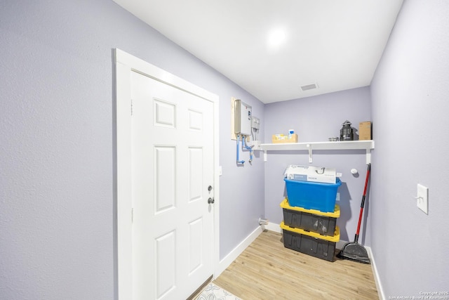 1437 Avant, San Antonio, TX 78210 - entryway featuring light wood-type flooring and baseboards