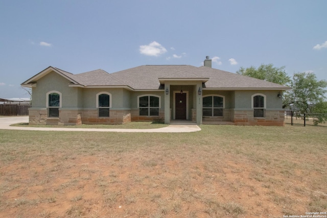 2516 County Road 357, La Vernia, TX 78121 - view of front of house featuring stucco siding, a chimney, and roof with shingles