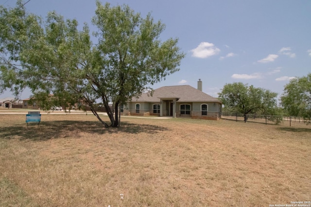 2516 County Road 357, La Vernia, TX 78121 - rear view of property with a chimney