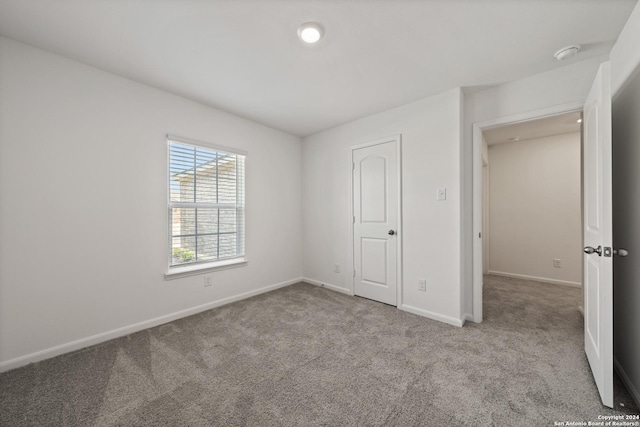 14923 Telfaire Mdw, Von Ormy, TX 78073 - unfurnished bedroom with carpet flooring and baseboards