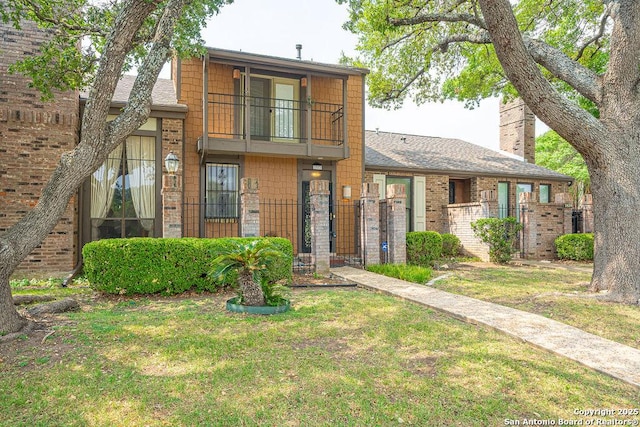 3922 Barrington Unit 0, San Antonio, TX 78217 - view of front of property featuring a balcony, a gate, and brick siding