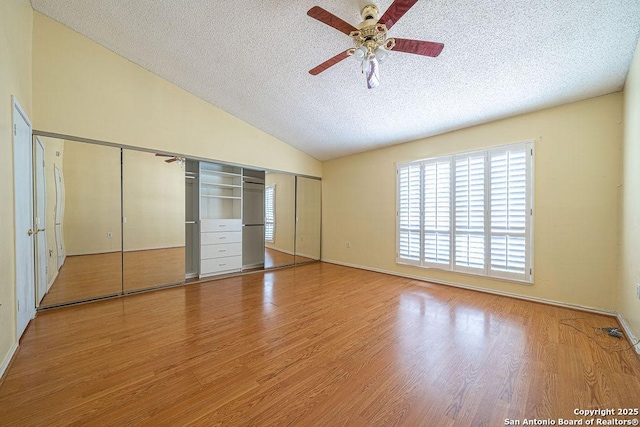 3922 Barrington Unit 0, San Antonio, TX 78217 - unfurnished bedroom featuring a textured ceiling, lofted ceiling, wood finished floors, and ceiling fan