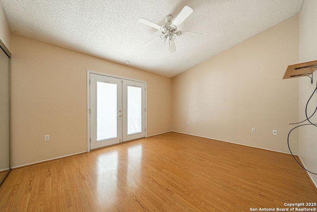 3922 Barrington Unit 0, San Antonio, TX 78217 - spare room with french doors, a textured ceiling, light wood-type flooring, ceiling fan, and lofted ceiling