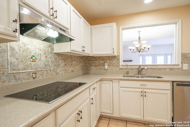 3922 Barrington Unit 0, San Antonio, TX 78217 - kitchen with under cabinet range hood, dishwasher, a sink, black electric stovetop, and a chandelier