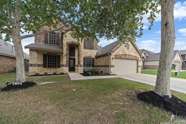 8726 Hideout, San Antonio, TX 78254 - view of front of property with stone siding, a garage, driveway, and a front yard