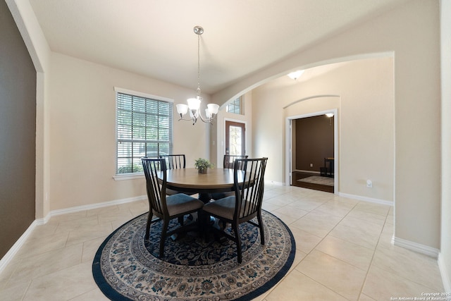 8726 Hideout, San Antonio, TX 78254 - dining area featuring arched walkways, a chandelier, baseboards, and light tile patterned flooring