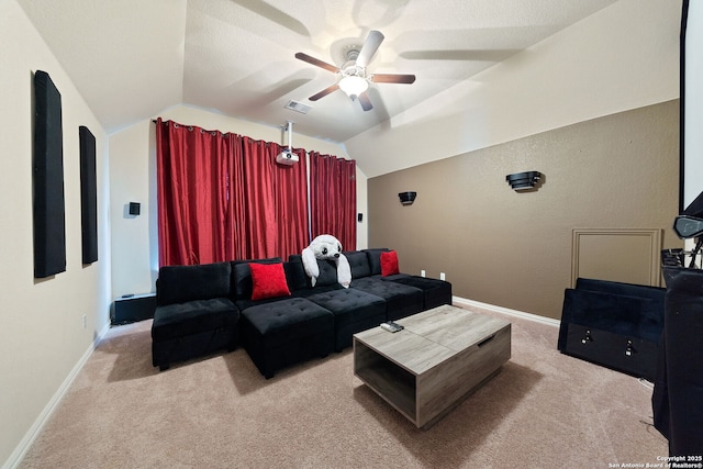 8726 Hideout, San Antonio, TX 78254 - home theater room featuring light carpet, a ceiling fan, vaulted ceiling, and baseboards
