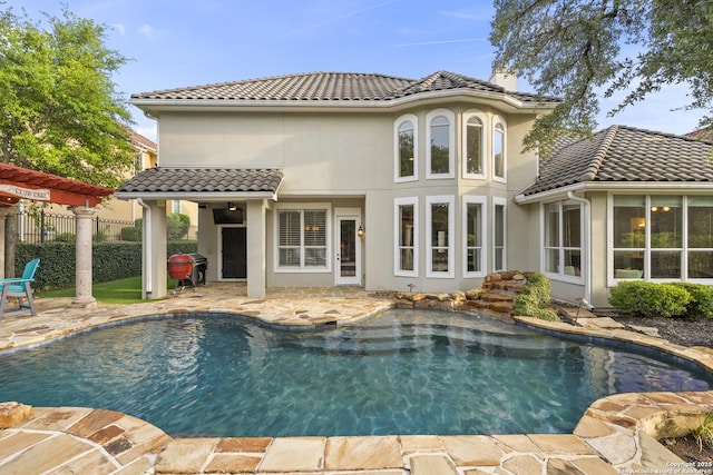 7414 Hovingham, San Antonio, TX 78257 - rear view of house featuring a tile roof, a patio, stucco siding, and a chimney