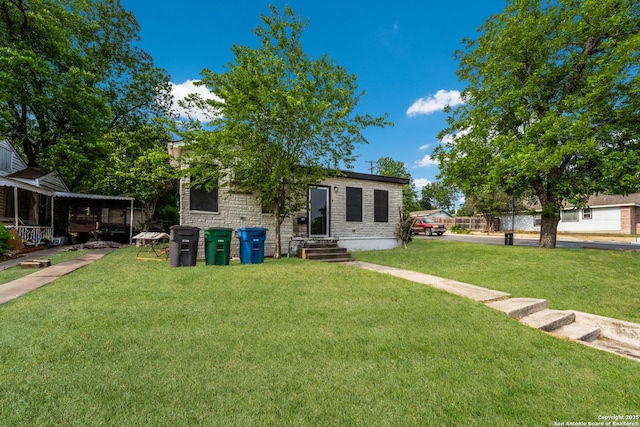 1019 Chicago Blvd, San Antonio, TX 78210 - view of front of property featuring entry steps, a front yard, and stone siding