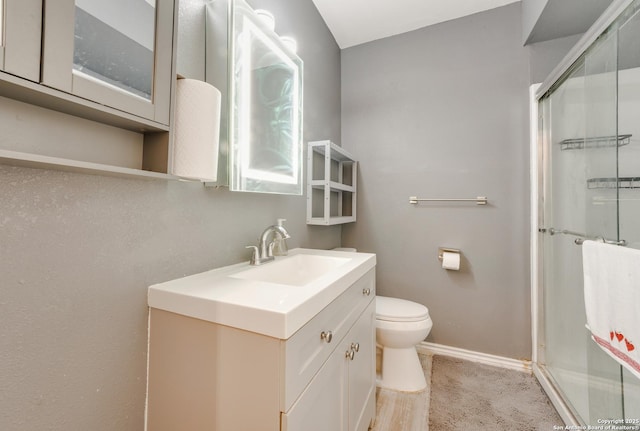 1019 Chicago Blvd, San Antonio, TX 78210 - bathroom featuring vanity, toilet, a shower stall, and baseboards