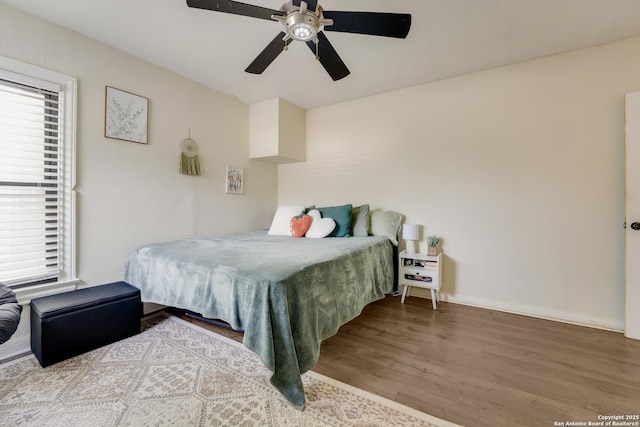 1019 Chicago Blvd, San Antonio, TX 78210 - bedroom with wood finished floors, multiple windows, and ceiling fan