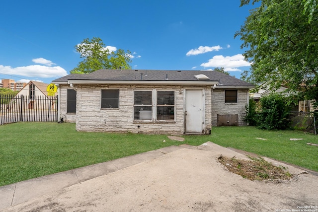 1019 Chicago Blvd, San Antonio, TX 78210 - back of property with stone siding, a shingled roof, and a patio