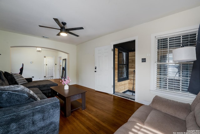 1019 Chicago Blvd, San Antonio, TX 78210 - living room featuring arched walkways, wood finished floors, and ceiling fan