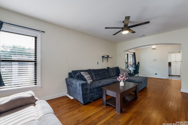 1019 Chicago Blvd, San Antonio, TX 78210 - living area featuring arched walkways, ceiling fan, wood finished floors, and baseboards