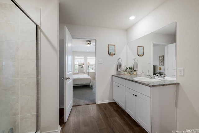 4015 Evaporite Trl, San Antonio, TX 78253 - bathroom featuring ensuite bathroom, wood finished floors, double vanity, a shower stall, and recessed lighting