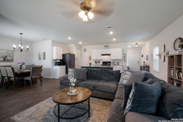 4015 Evaporite Trl, San Antonio, TX 78253 - living room featuring dark wood finished floors, a chandelier, ceiling fan, and recessed lighting