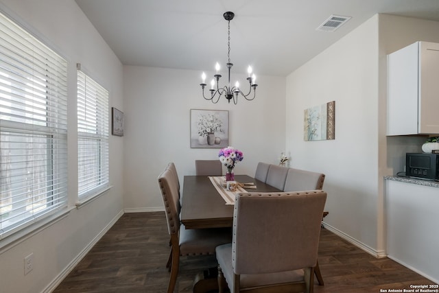 4015 Evaporite Trl, San Antonio, TX 78253 - dining room with a chandelier, dark wood-type flooring, and baseboards
