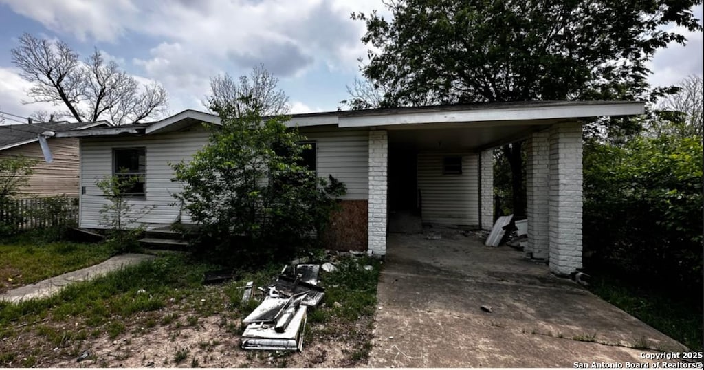 726 Price, San Antonio, TX 78211 - view of front of property featuring driveway and a carport