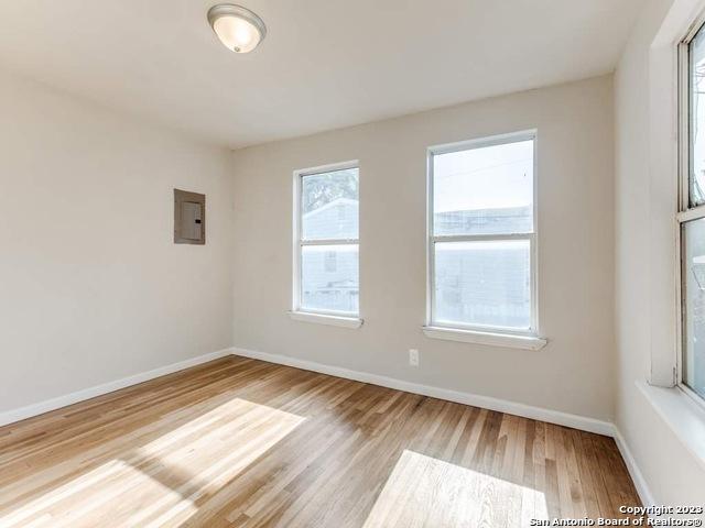 210 Harwood, San Antonio, TX 78213 - unfurnished room featuring wood finished floors, electric panel, and baseboards
