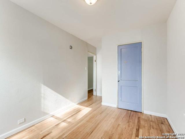 210 Harwood, San Antonio, TX 78213 - unfurnished room with light wood-style flooring and baseboards