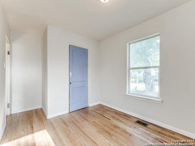 210 Harwood, San Antonio, TX 78213 - empty room featuring healthy amount of natural light, light wood-type flooring, and baseboards