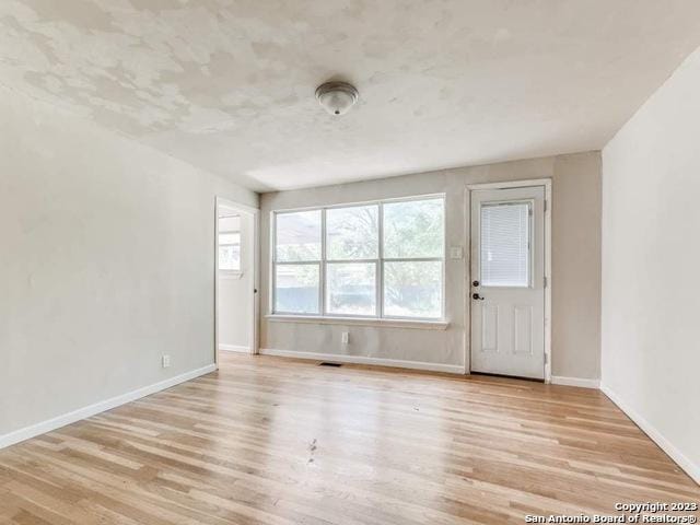 210 Harwood, San Antonio, TX 78213 - unfurnished room with wood finished floors and baseboards