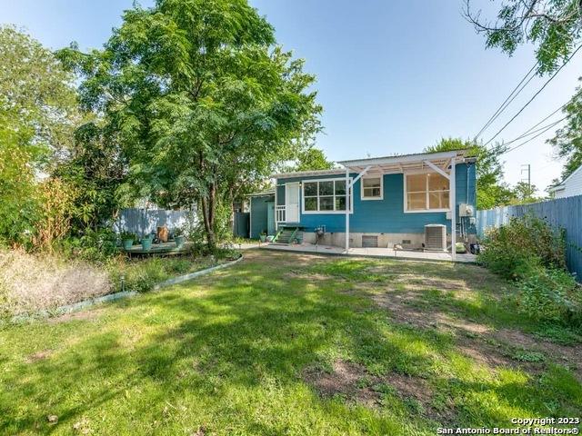 210 Harwood, San Antonio, TX 78213 - back of property featuring cooling unit and a patio area