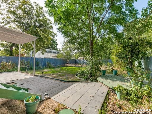 210 Harwood, San Antonio, TX 78213 - fenced backyard featuring a patio