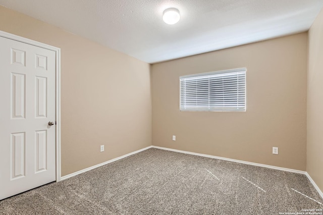 3803 Ponderosa Bnd, San Antonio, TX 78261 - spare room with carpet flooring, baseboards, and a textured ceiling